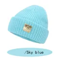 Sky blue knitted beanie for kids with a yellow smiley face leather patch and rolled cuff - S (6-36 Months) / Lake Blue