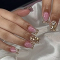 Pink coffin press-on nails with sparkling gold rhinestones and gemstones on silk background - Bz1614 Is Radiant With Gold. / Jelly Glue + Nail File