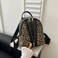 Mini leopard print backpack featuring black leather trim and stylish gold zippers - Black