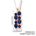 Rose gold necklace featuring teardrop and round blue stones with dimension specs - Rose Gold - Dark Blue Stone