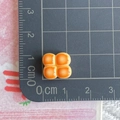 Detailed view of a 1cm mini resin bread charm on a grid cutting mat for DIY crafts - Four Square Bread Blocks