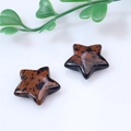 Star-shaped mahogany obsidian stones with smooth finish and natural brown patterns - Mahogany Obsidian