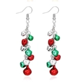 Close-up of festive Christmas bell earrings with red and green metal bells on silver hooks - US Size 6