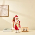 Standing Santa Claus doll in red sequined coat carrying burlap gift bags - 45cm
