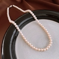 French vintage pearl necklace with zirconia and silver clasp displayed on silk - 37# Necklace-Pink-Single Strand