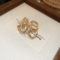 Macro shot of gold intertwined double ring earrings on a vintage paper background - Irregular Interlocking Double Rings Style (9# Gold)