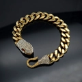 Bracciale a serpente placcato oro con occhi rossi e cristalli su superficie nera - Oro (Occhi Rossi)
