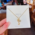 Elegant gold double butterfly necklace with zircon stones on an accessories card - X377 Gold Double Butterfly Zirconia