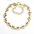 Detail of gold star and moon bracelet with micro-paved cubic zirconia stones - Star & Moon / Gold