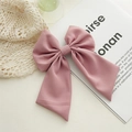 Elegant dusty pink fabric bow hair clip with spring fastener shown on lace background - Lotus Pink