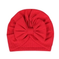 Close-up of red ribbed knit baby turban hat featuring a large decorative bow detail - Red