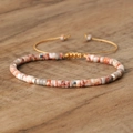 Woven bohemian bracelet with orange textured imperial stone beads and adjustable cord - No.45 Red Network Stone