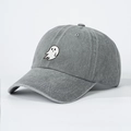 Detail of grey washed denim baseball cap with white ghost embroidery and vintage texture - One Size / Gray