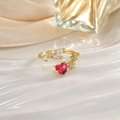 Close-up of golden adjustable ring with a red heart-shaped gemstone and floral details - Red Heart Leaf Decor (JZ0152F)