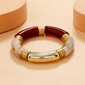 Detail of bohemian acrylic tube bracelet in gold, burgundy, and marble cream finishes - Burgundy / Marble / Gold