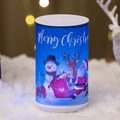Blue cylindrical Christmas night light with festive Santa and snowman illustrations - Medium Blue Snowman Santa Style