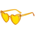 Close-up of heart-shaped sunglasses with orange glitter frames and yellow lenses - Glitter Yellow