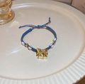 Blue woven cord bracelet featuring a gold bow pendant and opal beads for women - 8# Pearl Bow Blue Cord Bracelet / Haze Blue