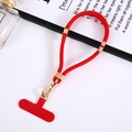 Detail of red nylon phone lanyard with gold metal buckle and matching fixing pad - Red
