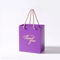 Purple paper gift bag with golden Thank You lettering and braided rope handles - 13x8x15cm / Purple + Champagne Handle