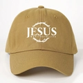 Close-up of JESUS printed khaki baseball cap showing high-density cotton twill fabric details - One Size / Turmeric