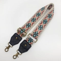 Close-up of ethnic geometric pattern strap with vintage bronze clips and leather ends - Antique Bronze Hook / No.6 Black Leather