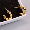 Macro detail of gold-plated twisted rope hoop earrings resting on a jewelry box - Outer Diameter 17mm / 18K Gold