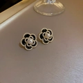 Detail of vintage enamel camellia earrings with gold trim and delicate pearl accents - 16# Black & White Camellia Pearl Stud Earrings