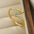 Anello regolabile Malocchio dorato con pietre di zircone verde in portagioie - Malocchio Dorato