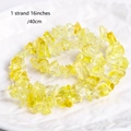 Detailed macro view of yellow natural crystal stone beads on a 16 inch strand - Topaz