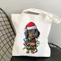 Close-up of a white canvas tote bag featuring a festive Christmas dachshund print - C10 / No Inner Pocket No Zipper