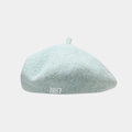Close-up of mint blue beret featuring white 1987 embroidery and soft wool texture - One Size / Light Blue