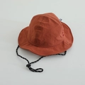 Detail of caramel nylon sun hat featuring adjustable polka dot drawstring and wide brim - 52cm / Caramel color