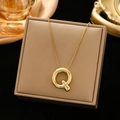 Golden Q letter pendant on a fine snake chain necklace displayed on a beige jewelry box - Gold-Q