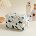 Quilted floral makeup bag featuring blue and khaki bear patterns with zip closure - Bears on White