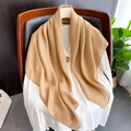 Detail view of khaki linen-feel scarf draped elegantly over a white shirt on a wooden chair - Khaki
