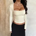 Slim fit long sleeve square neck top for women in cream beige with delicate lace trim - S / Apricot