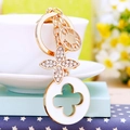 Golden flower keychain with white rhinestones and a LOVE FOREVER engraved disc charm - White Luxury Clover
