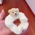 Close-up of a plush white scrunchie featuring a cute beige teddy bear head accessory - Scrunchie-White Bear