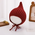 Detail of red pointed knit baby hat showing ribbed texture and chin straps on mannequin - 46-48cm (6-15 Months) / Red