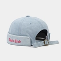 Detail of adjustable metal buckle and red Music Club embroidery on denim docker hat - Music Club Embroidery Style / Light Blue