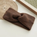 Close-up of coffee brown knit twisted headband with detailed wool texture on a tray - Dark Coffee