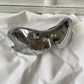 Detailed top view of futuristic silver mirrored cycling sunglasses on white fabric - Tech One-piece Mercury Color