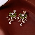 Detail of vintage gold tassel earrings with emerald green and white zircon gemstones - Silver Needle / Gold-Green
