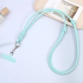 Detail of mint green leather phone crossbody lanyard with adjustable knots and silver clip - Light Green