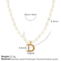 Elegant gold letter D pendant necklace featuring white freshwater pearls and stainless steel - Letter D(XL185珍珠D金色项链)