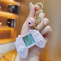 Pink game controller keychain with mini LCD screen, bell and gold ring accessory - Pink Controller Style Game Console