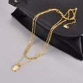 Double-layered golden necklace with rectangular white pendant and Figaro chain links - 18K Gold-White