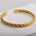 Elegant gold twisted wire open cuff bracelet with stylish square polished end caps - Gold