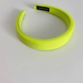 Detail view of neon yellow padded sponge headband with handmade inner fabric label - Neon Yellow